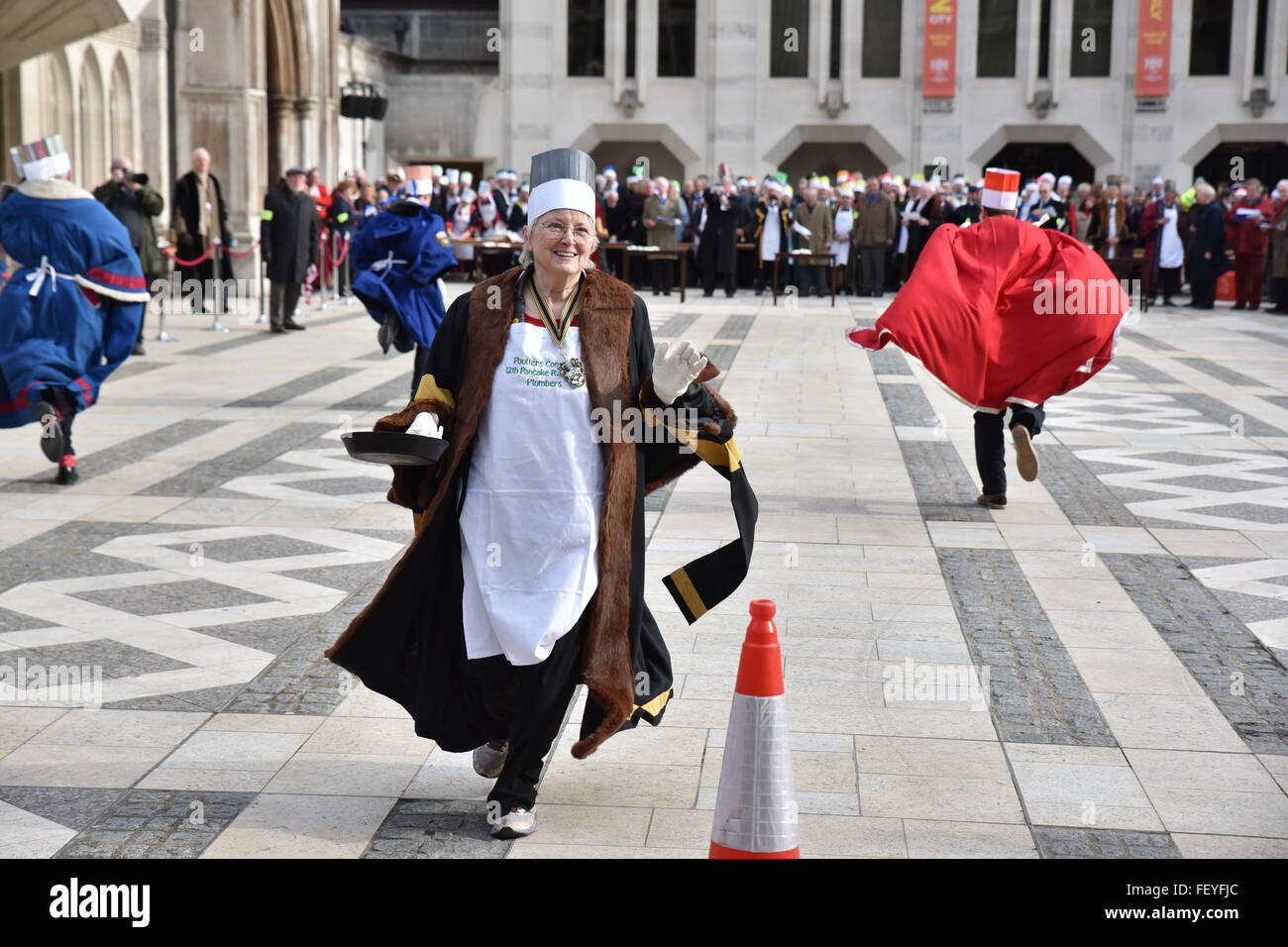 Guildhall Yard, London, UK. 9th February 2016. The Poulters’ Pancake Race on Shrove Tuesday in Guildhall Yard. Stock Photo