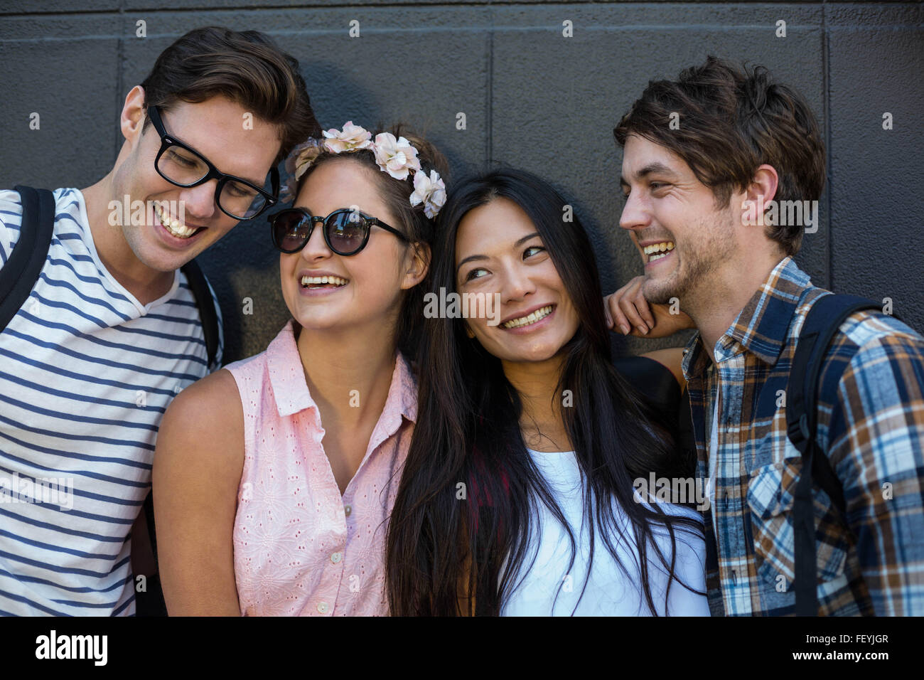 Hip friends smiling Stock Photo