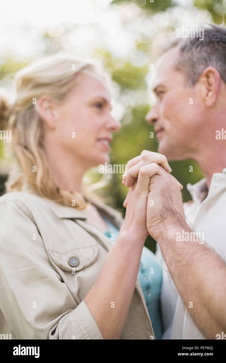Cute couple dancing and holding hands Stock Photo