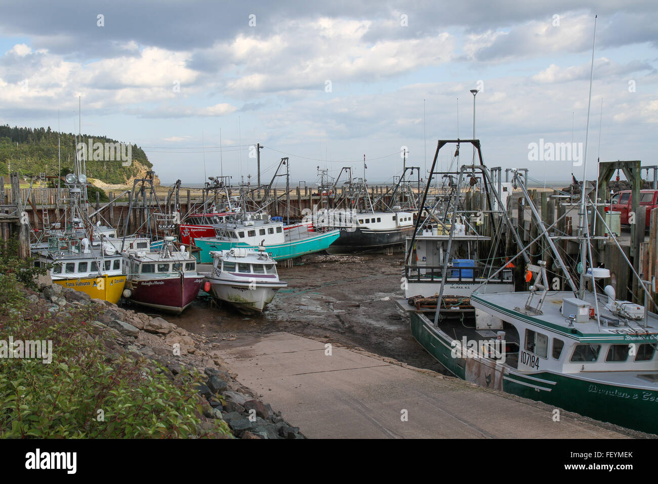 Fishing Boats on the ground at Low Tide Stock Photo Alamy