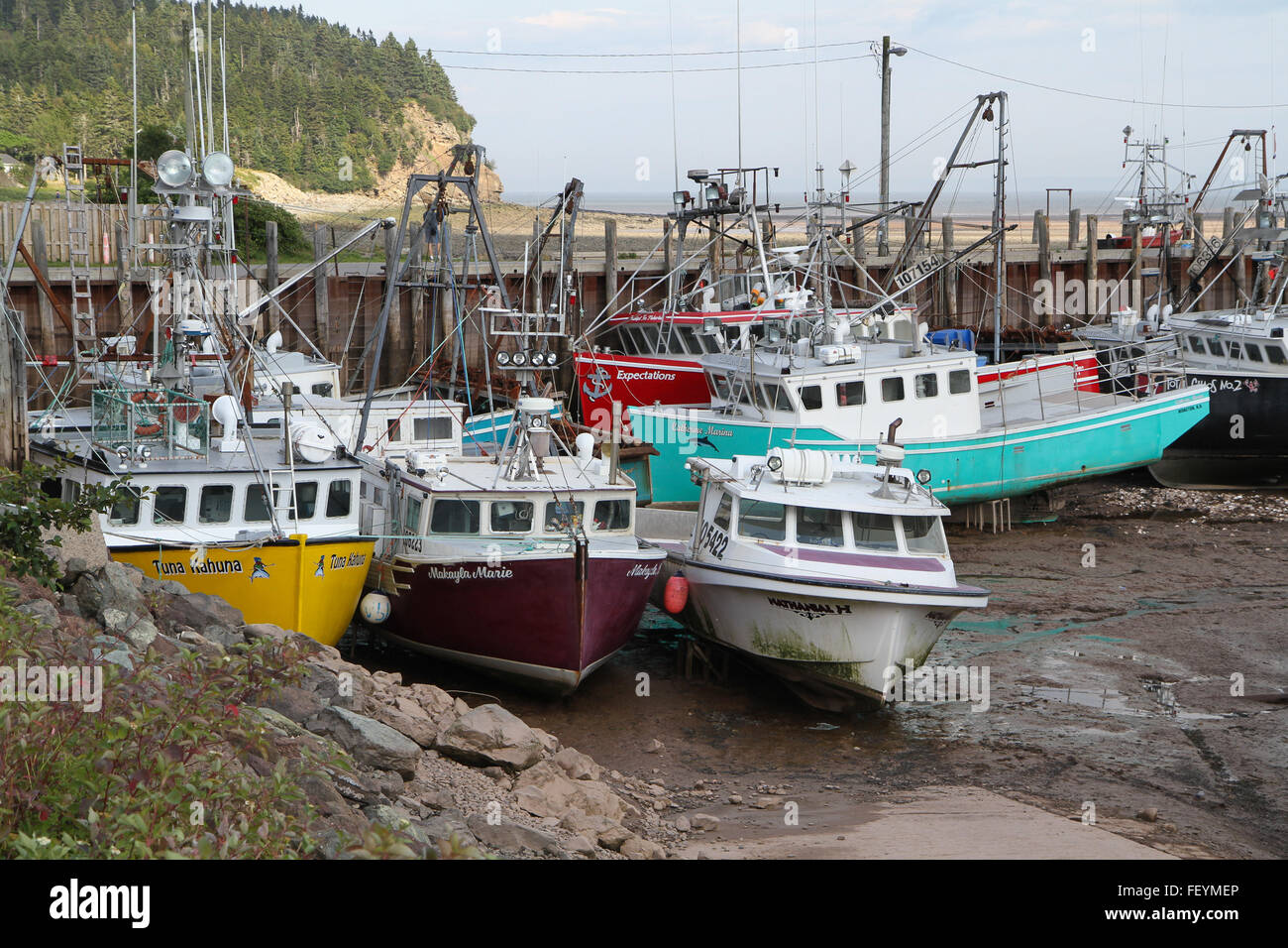 Fishing Boats on the ground at Low Tide Stock Photo Alamy