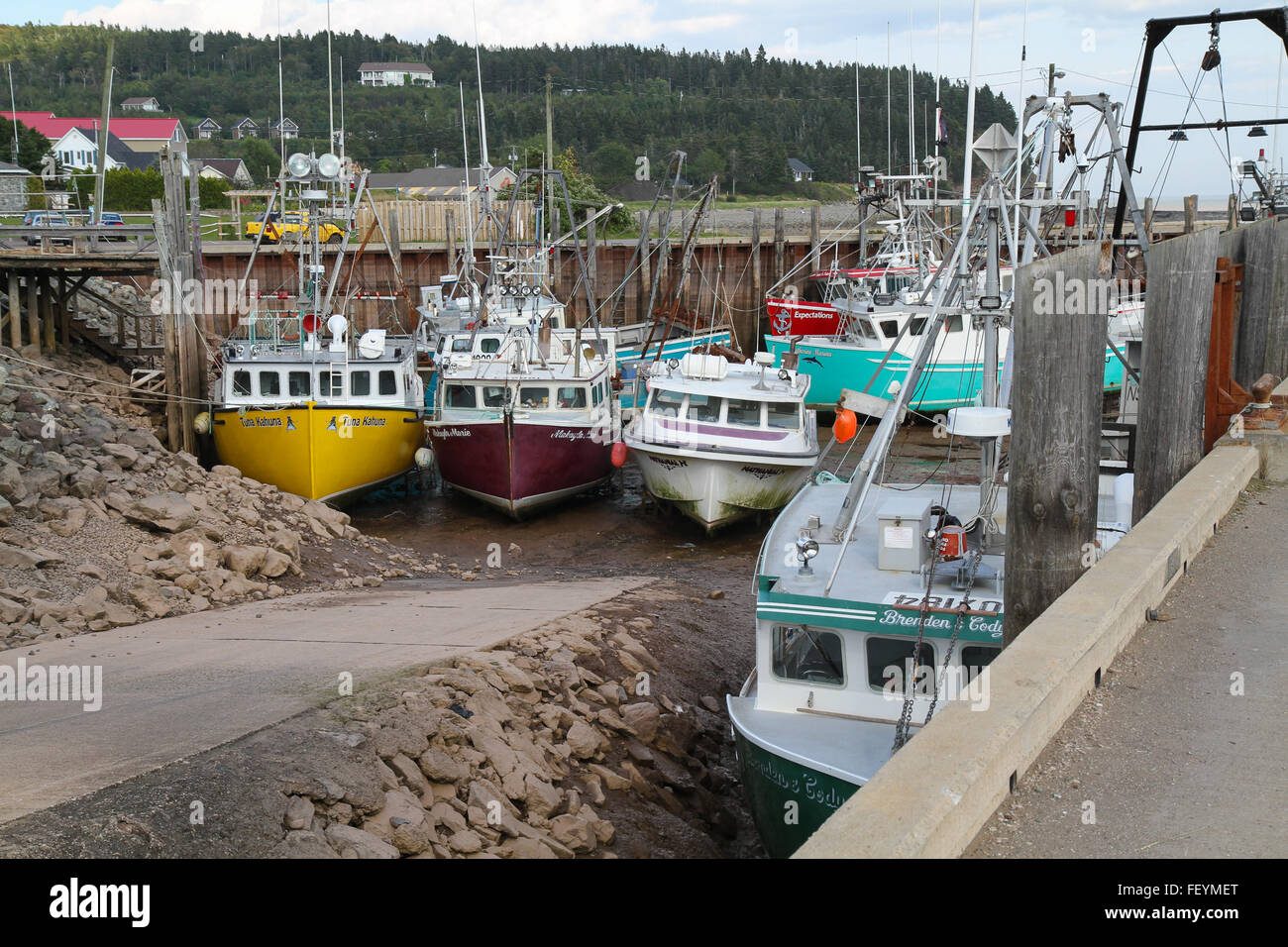 Fishing Boats on the ground at Low Tide Stock Photo Alamy