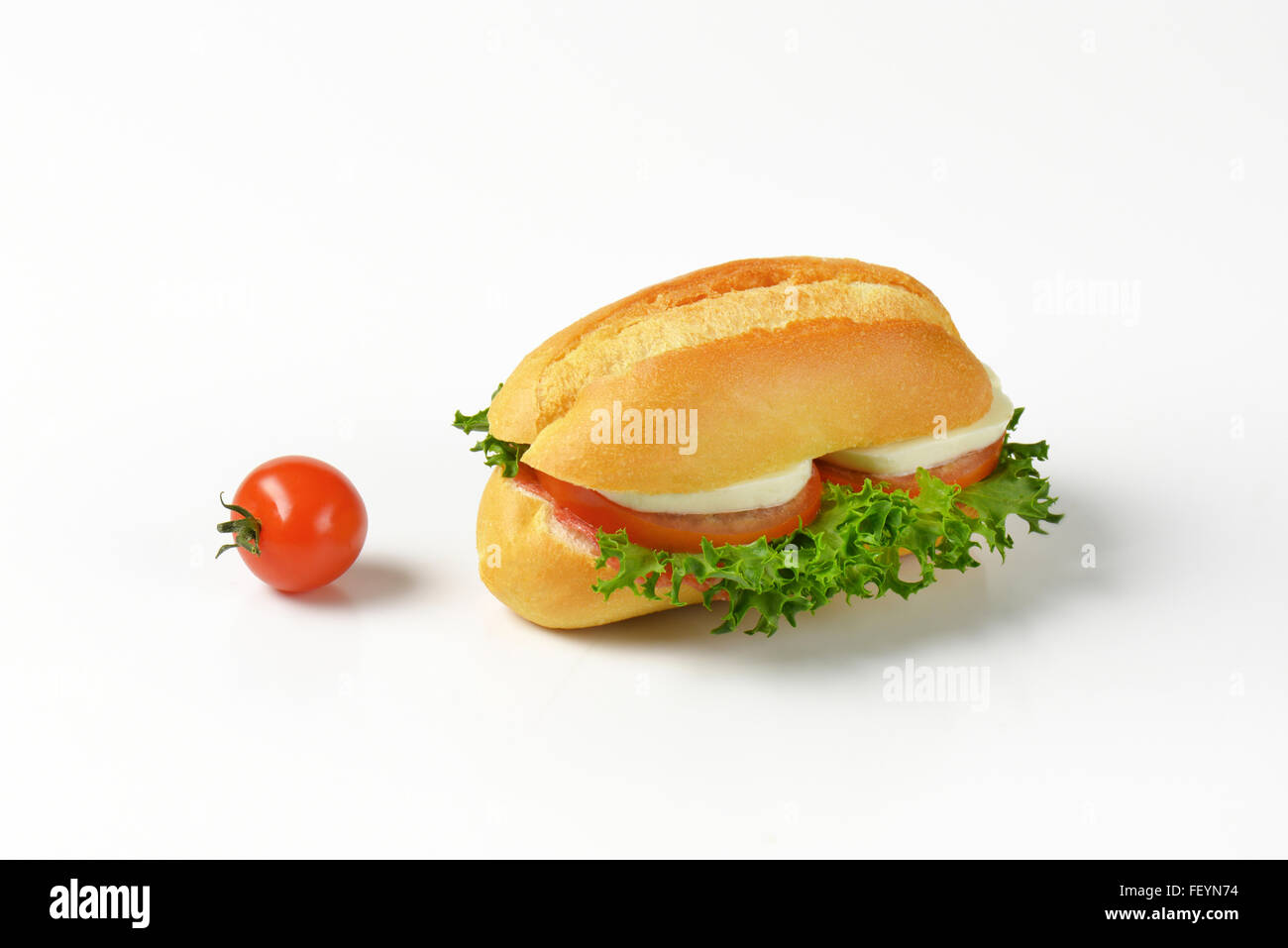 bun sandwich with mozzarella cheese, tomato and lettuce Stock Photo Alamy