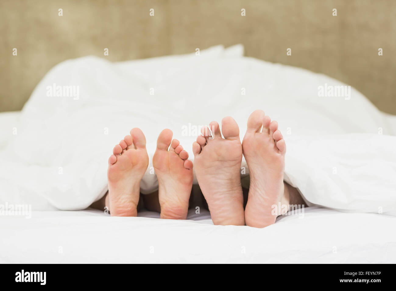 Close up of couples feet Stock Photo