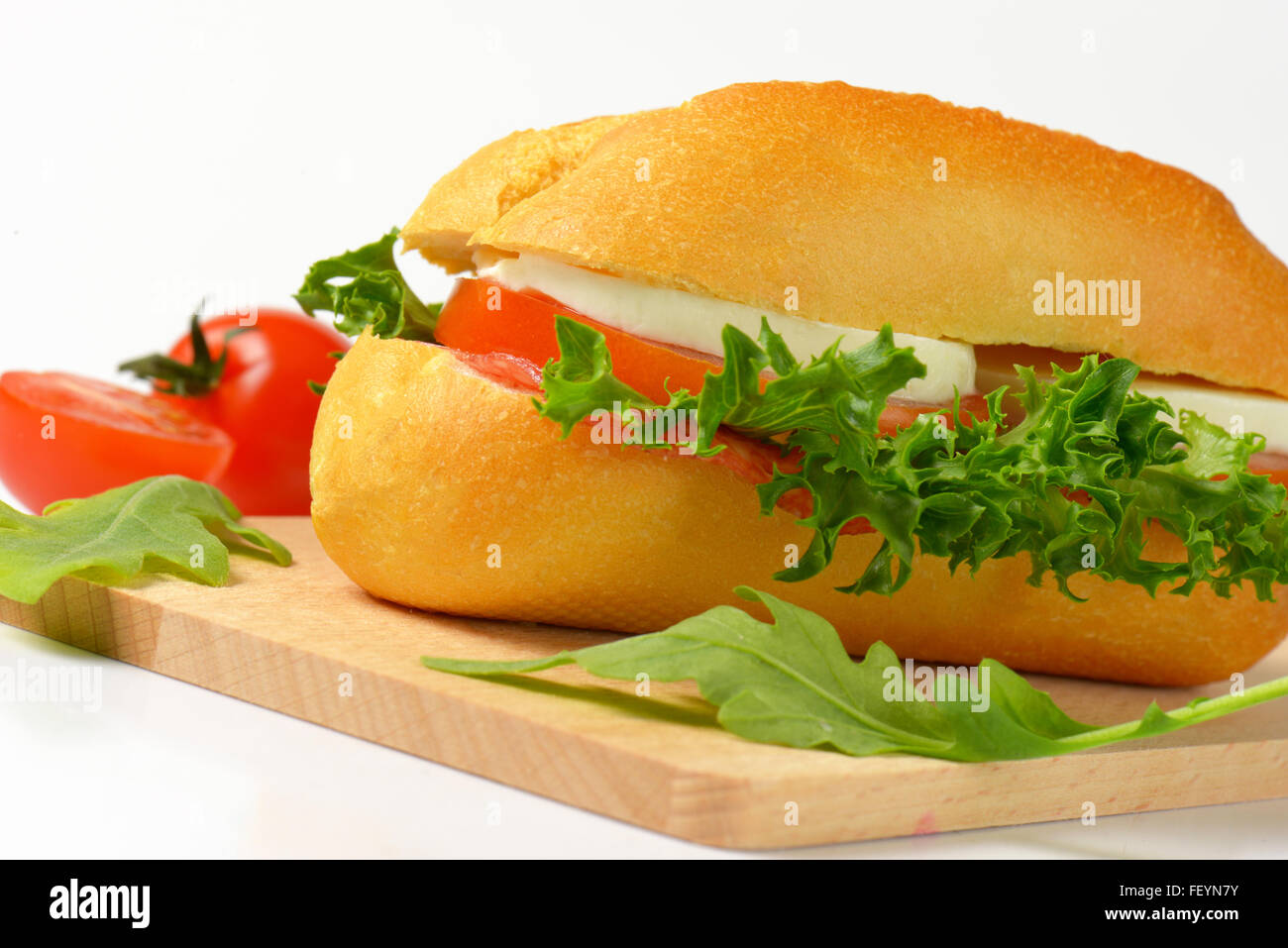 bun sandwich with mozzarella cheese, tomato and lettuce Stock Photo Alamy