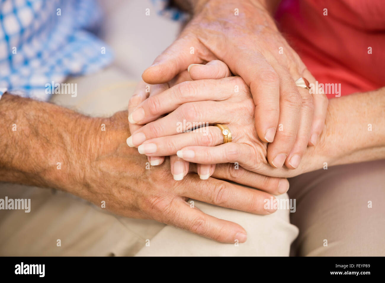 Senior couples hands together Stock Photo