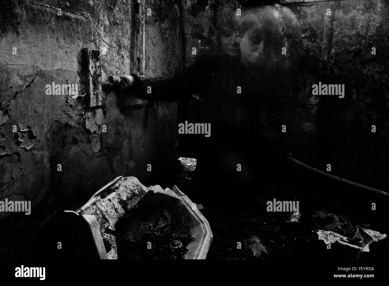 Ghost in abandoned house Stock Photo