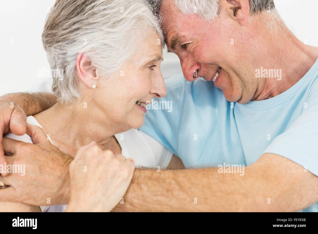 Smiling senior couple face to face Stock Photo