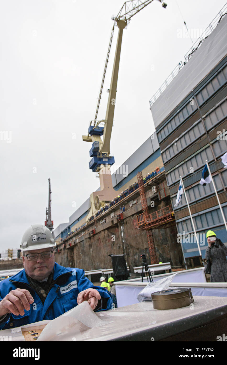 Turku, Finland. 9th February. Keel-laying of the new Tallink LNG-shuttle Megastar at the Meyer Turku Shipyard. Kari Toivonen is sealing the lucky coins which are placed under the keel of the vessel. Credit:  Stefan Crämer/Alamy Live News Stock Photo