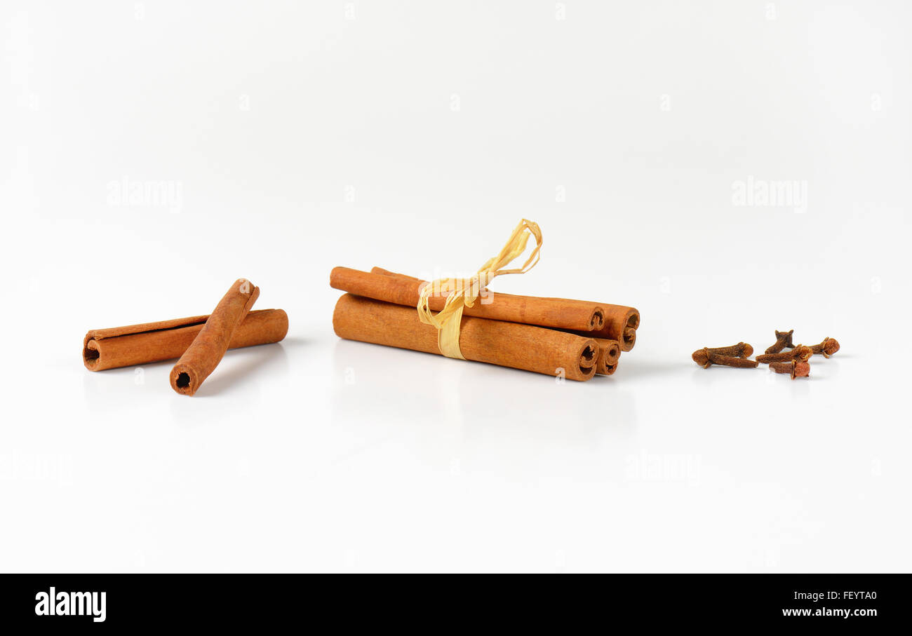 cinnamon sticks and cloves on white background Stock Photo Alamy