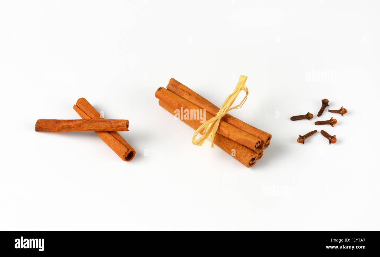 cinnamon sticks and cloves on white background Stock Photo Alamy