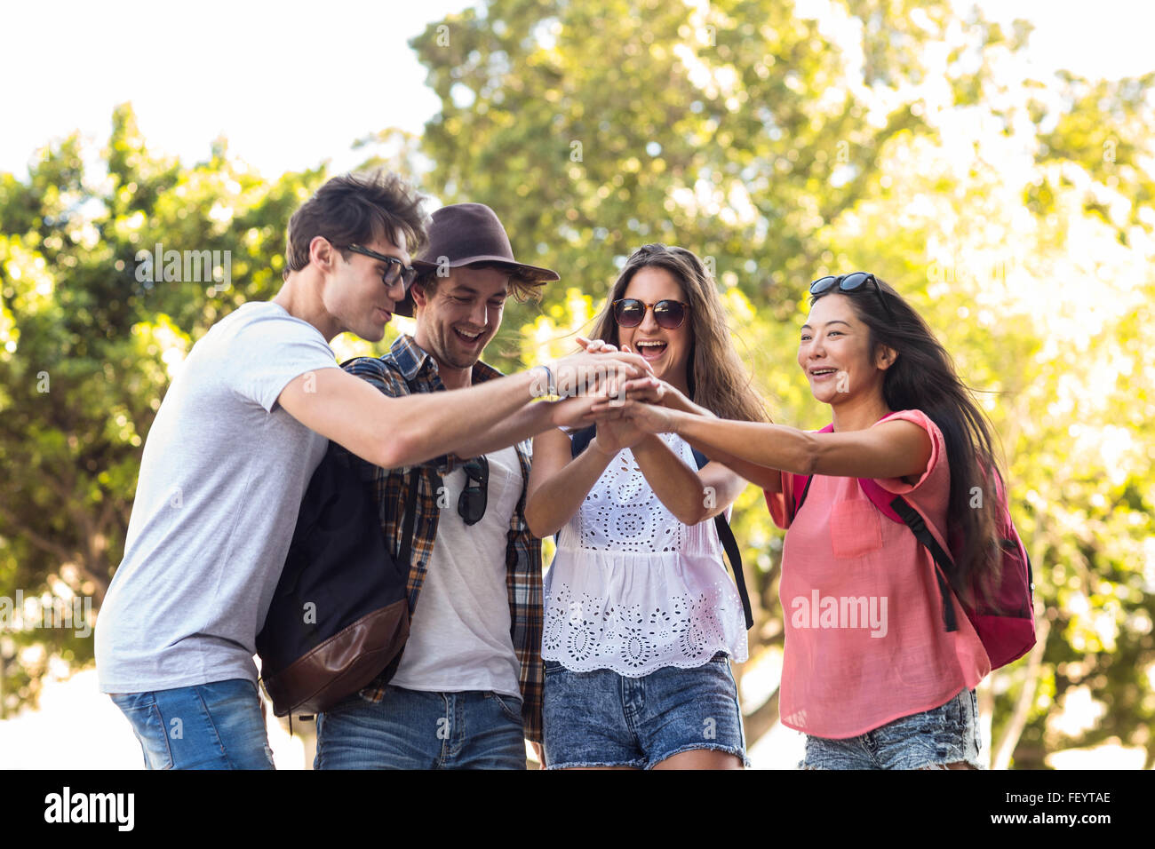 Hip friends cheering up Stock Photo