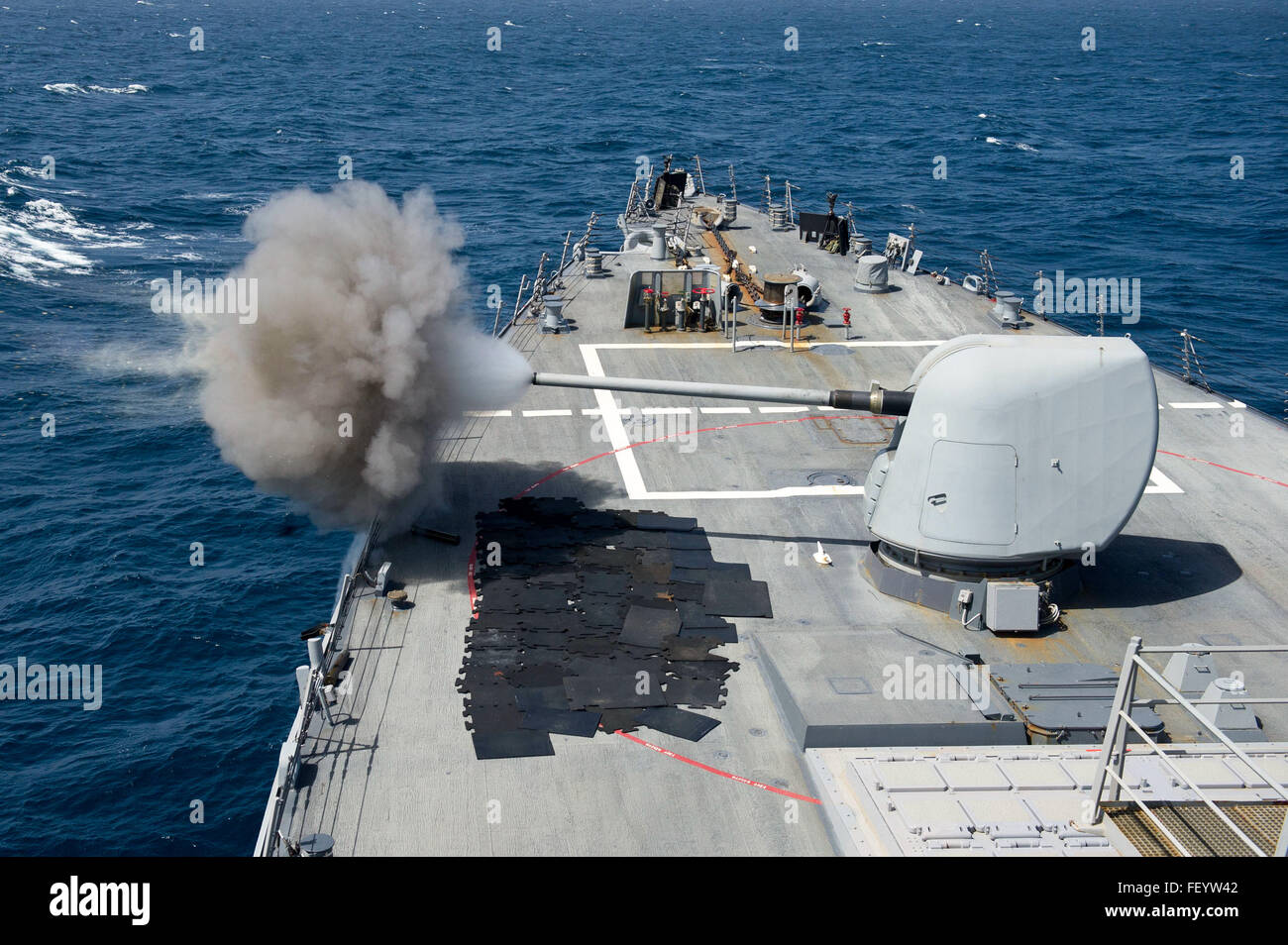 160130-N-VE959-216 INDIAN OCEAN (Jan. 30, 2016) Guided-missile destroyer USS Gonzalez (DDG 66) conducts a live-fire exercise using a MK 45 5-inch gun. Gonzalez is deployed as part of the Harry S. Truman Carrier Strike Group, supporting maritime security operations and theater security cooperation efforts in the U.S. 5th Fleet area of operations. Stock Photo