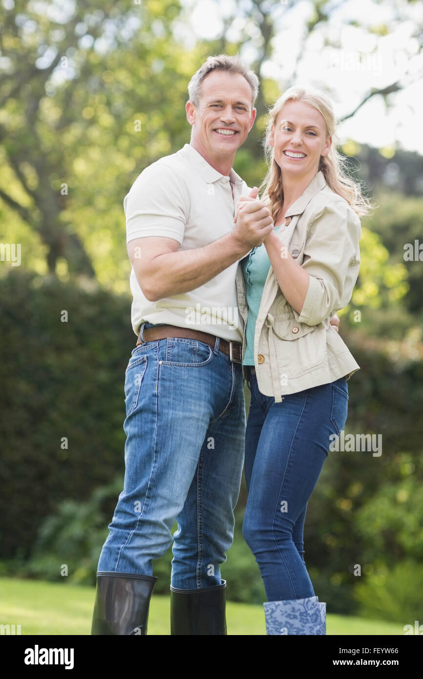 Cute couple dancing and holding hands Stock Photo