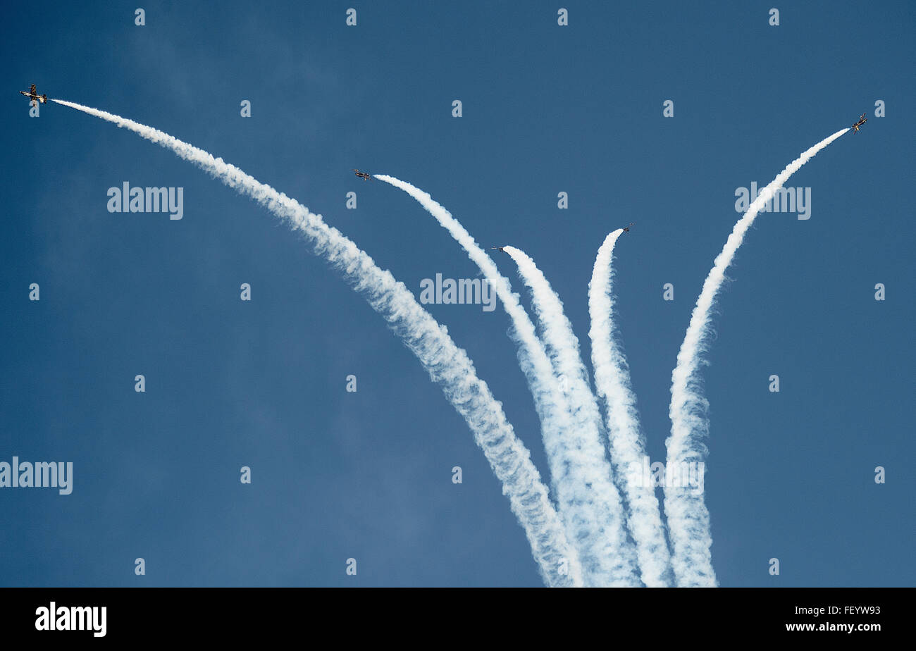 “Al Fursan” (The Knights), the United Arab Emirates Air Force aerobatic display team, flies in formation during the 2015 Dubai Air Show, Nov. 9, 2015. The air show is a biennial event and is recognized as the premier aviation and air industry event in the Gulf and Middle East region and is one of the largest air shows in the world. Stock Photo