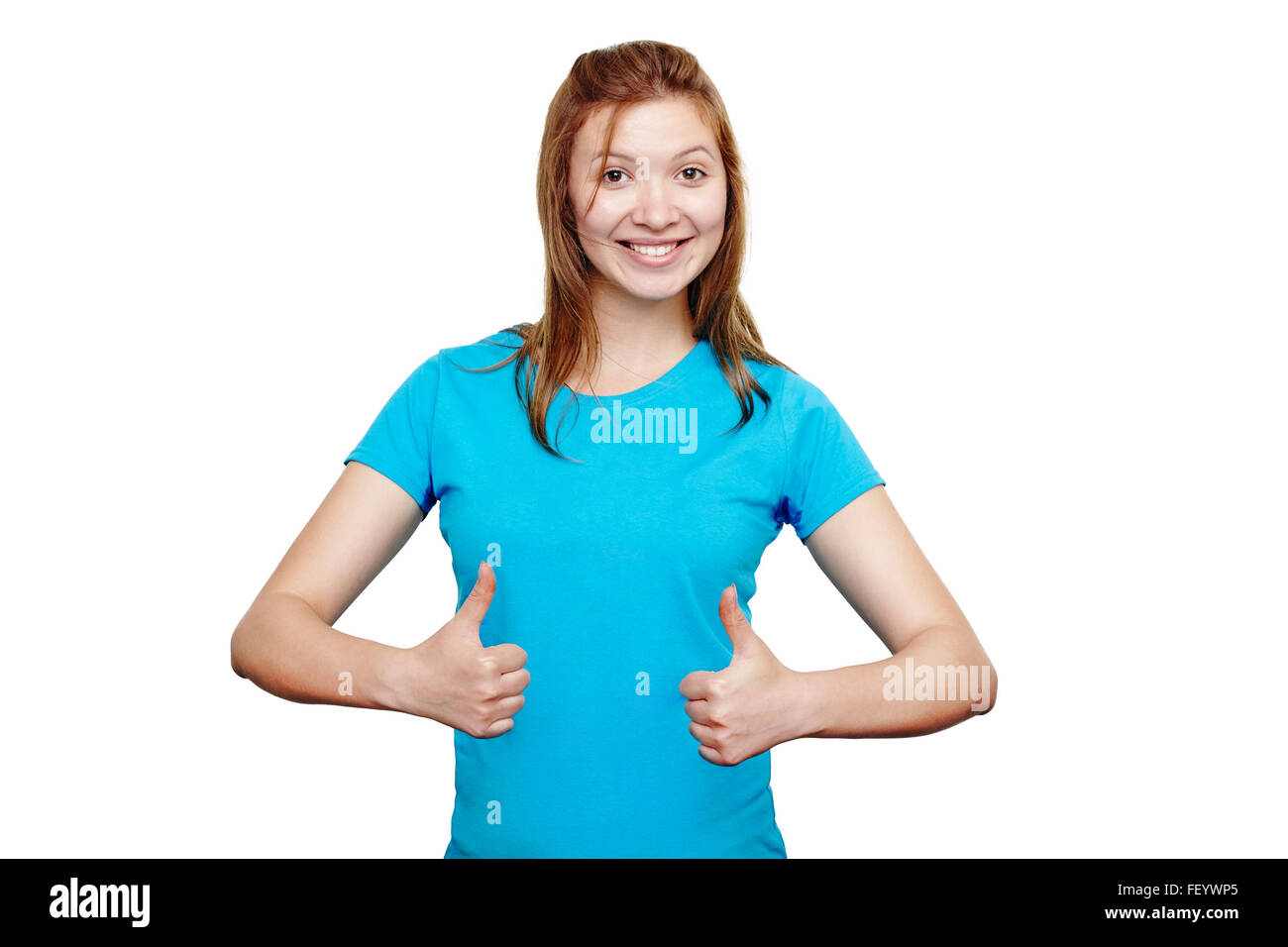 Smiling young woman showing thumbs up Stock Photo