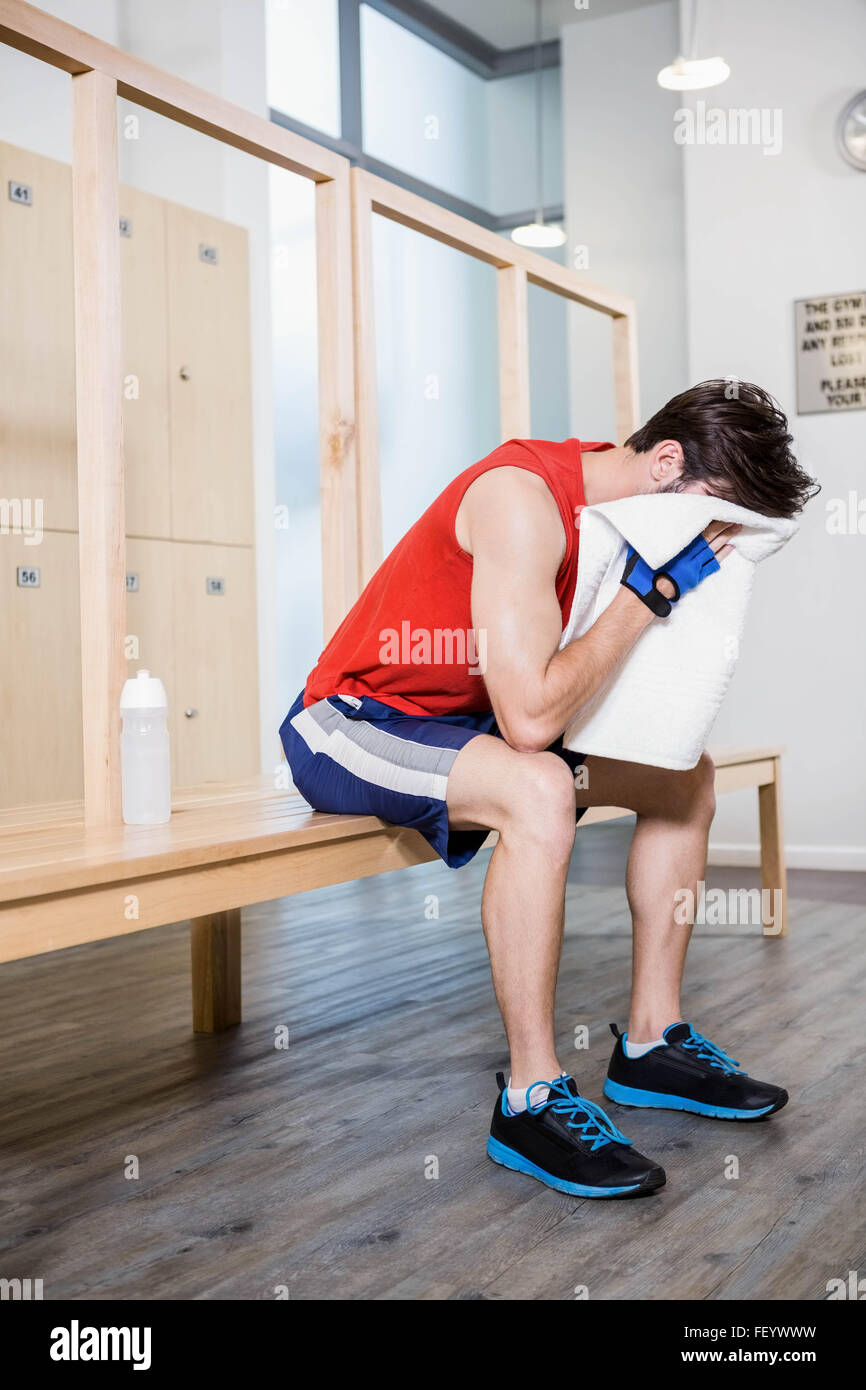 Tired man with towel on his face Stock Photo Alamy