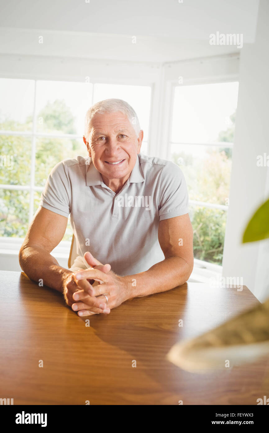 Calm senior man sitting in living room Stock Photo - Alamy