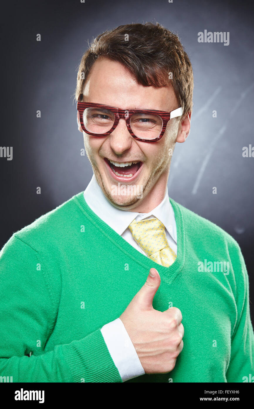 Nerd young man showing thumbs up Stock Photo