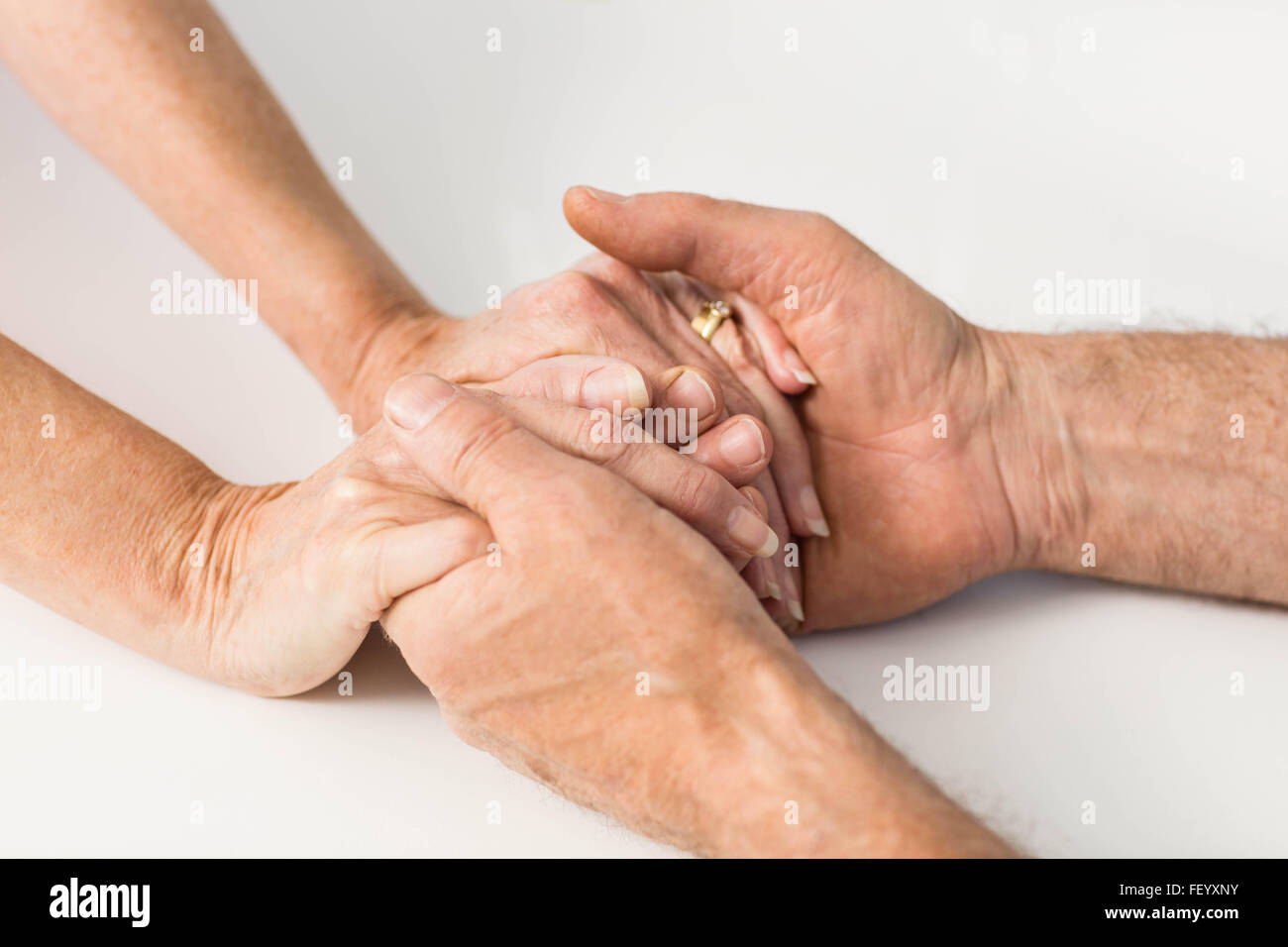 Seniors hands together Stock Photo