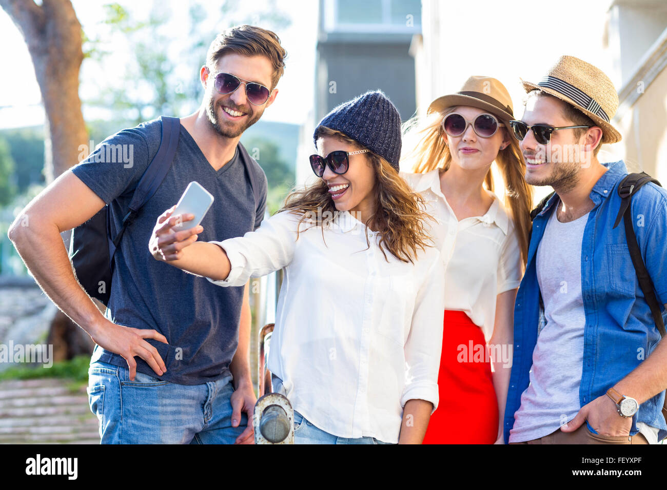 Hip friends taking selfies Stock Photo