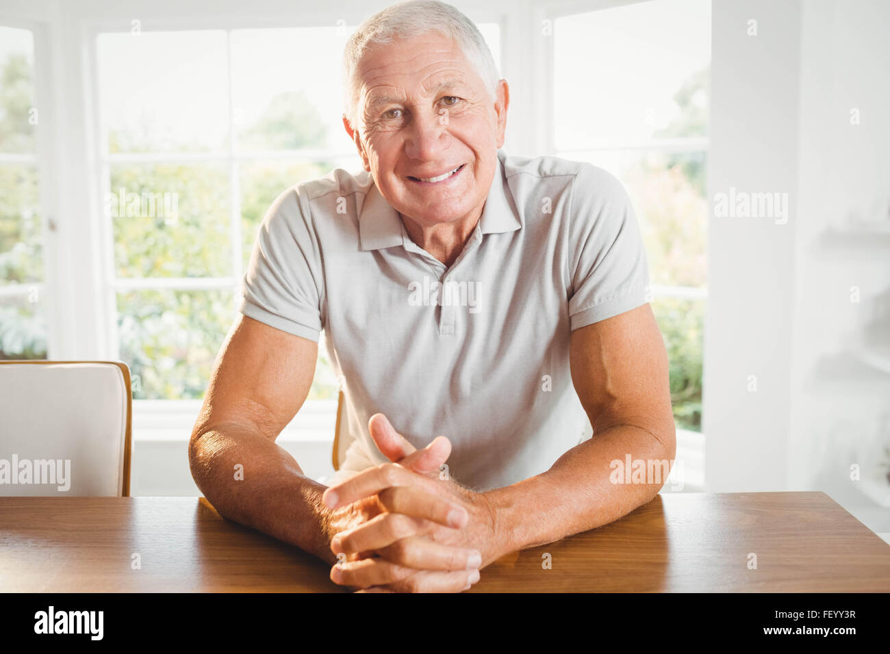 Happy senior man crossing fingers Stock Photo