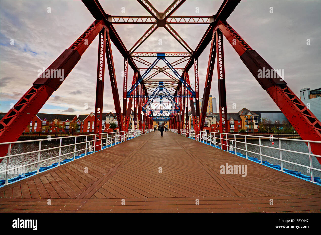 Crossing the rotating former railway bridge at Salford Quays, Manchester Stock Photo