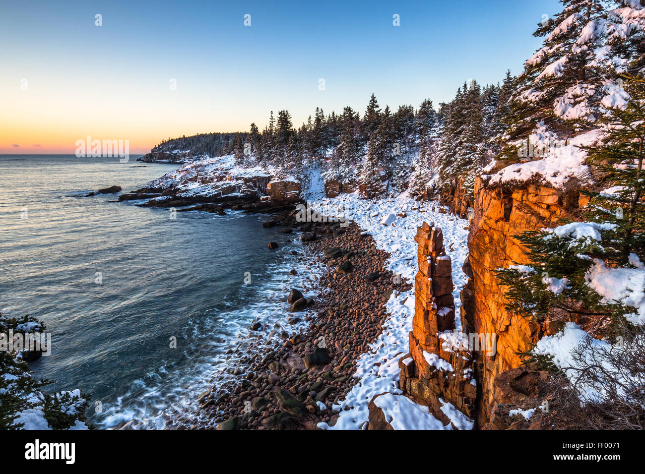 Snow covered Monument Cove in winter in Acadia National Park, Mount Desert Island, Maine, New England, USA. Stock Photo