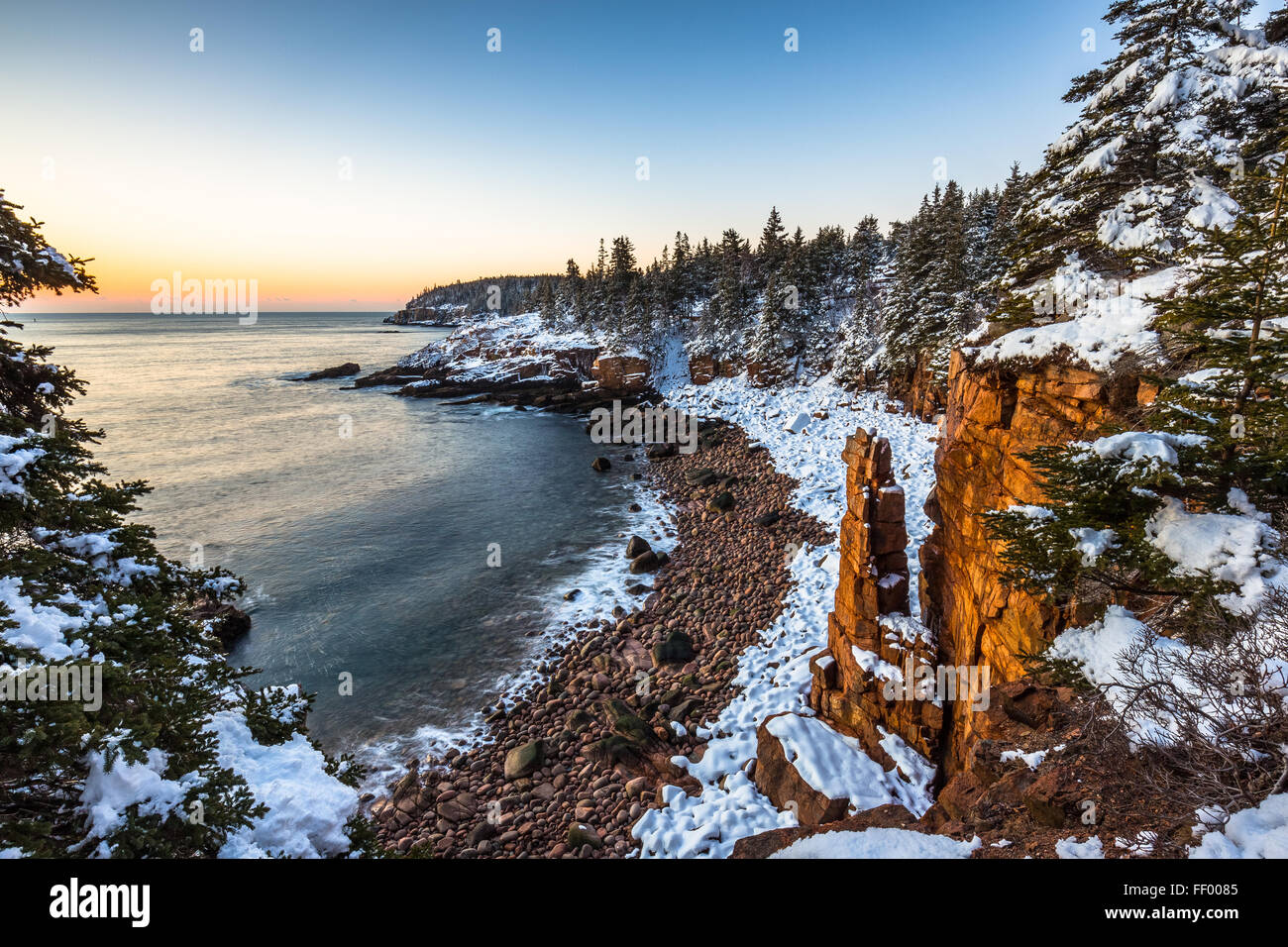 Snow covered Monument Cove in winter in Acadia National Park, Mount Desert Island, Maine, New England, USA. Stock Photo