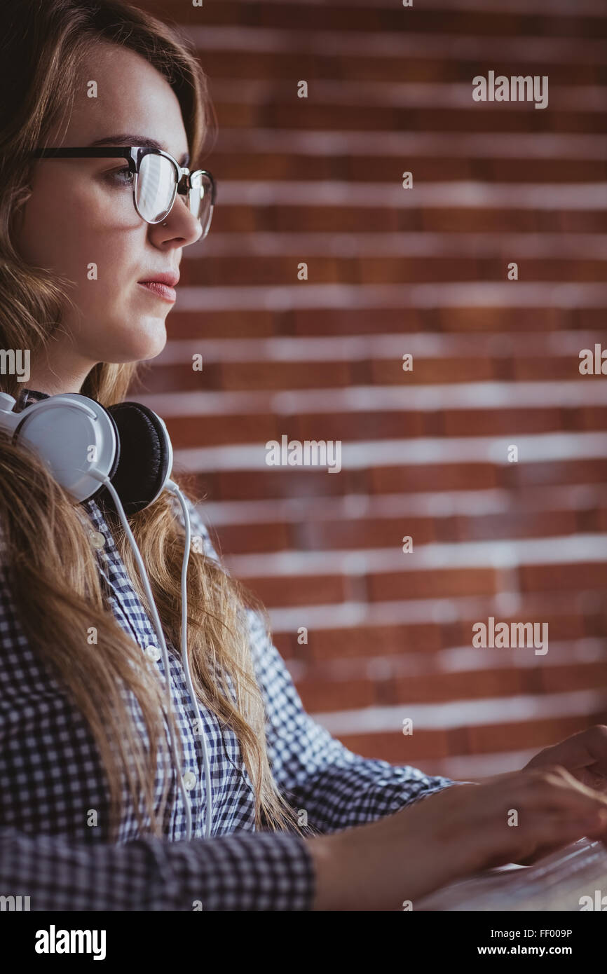 Focused hipster businesswoman with headphone Stock Photo