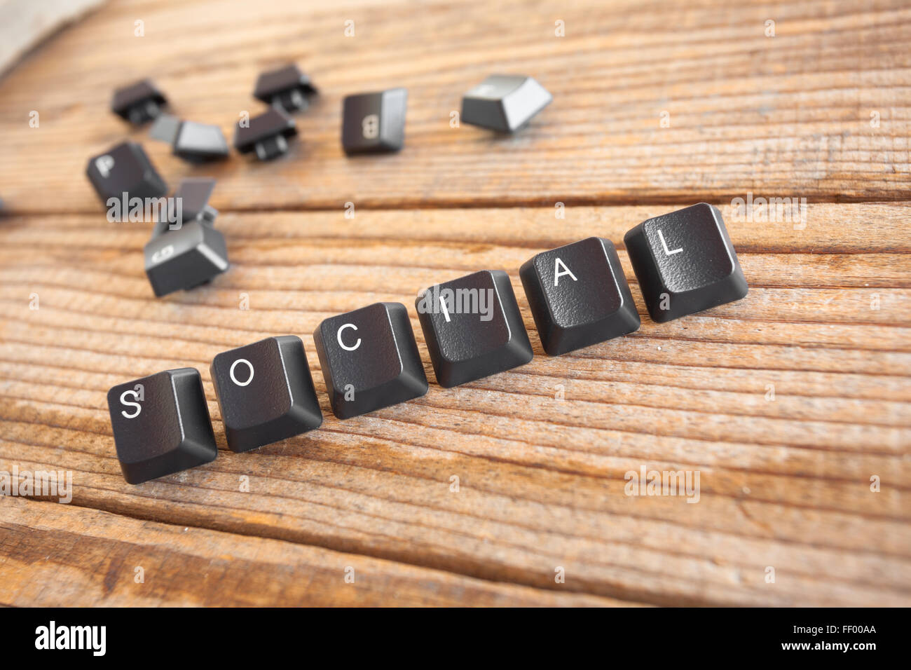 SOCIAL wrote with keyboard keys on wooden background, vintage denim effect Stock Photo
