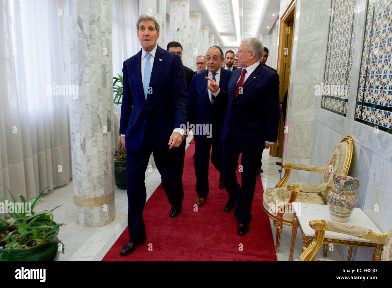 Secretary Kerry Walks with Foreign Minister Baccouche at the Ministry of Foreign Affairs in Tunis Stock Photo