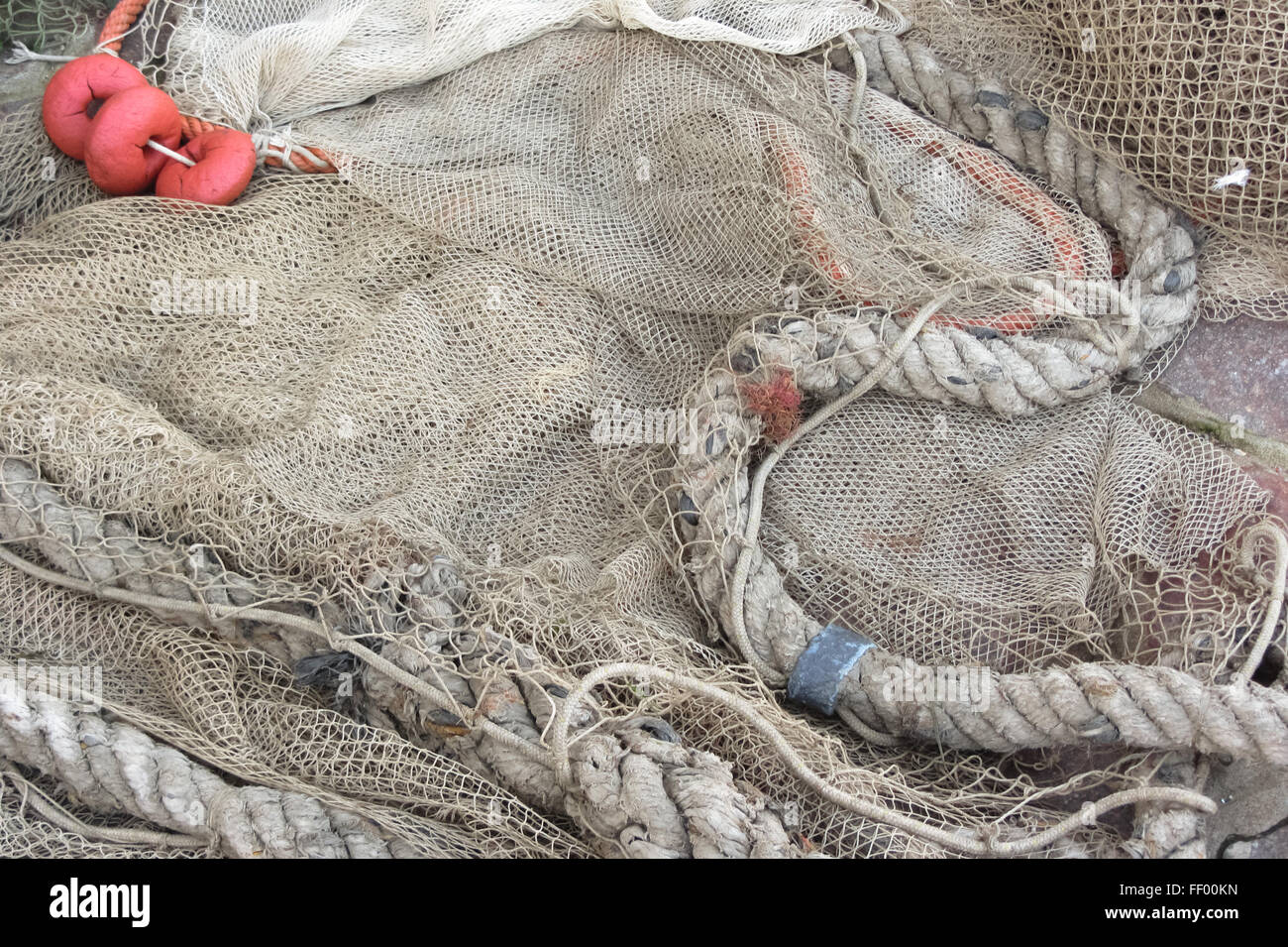 Used fishing net with floaters Stock Photo - Alamy