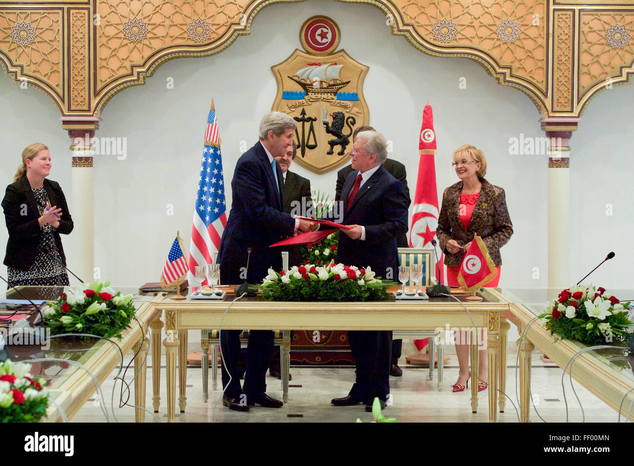 Secretary Kerry Shakes Hands with Foreign Minister Baccouche after Signing Agreement at the Ministry of Foreign Affairs in Tunis Stock Photo