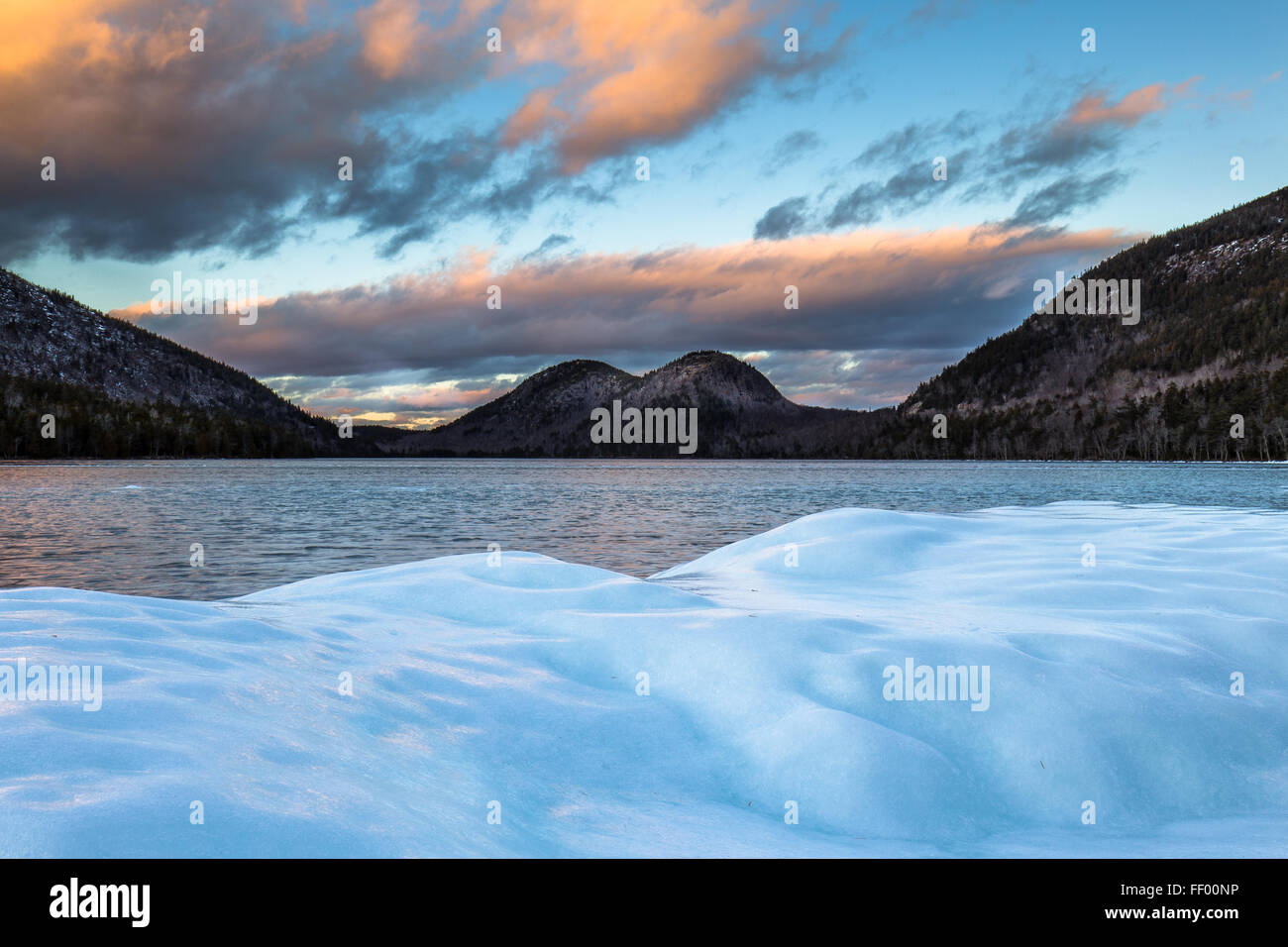 The Bubbles seen from the ice covered shore of Jordan Pond in winter in Acadia National Park, Mount Desert Island, Maine. Stock Photo