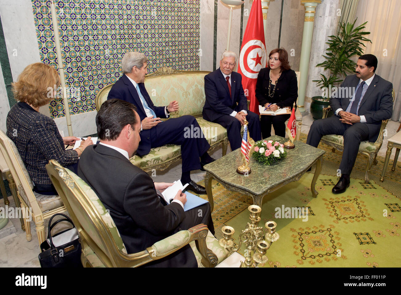 Secretary Kerry and his Delegation Sit with Foreign Minister Baccouche Before a Bilaterial Meeting at the Ministry of Foreign Affairs in Tunis Stock Photo