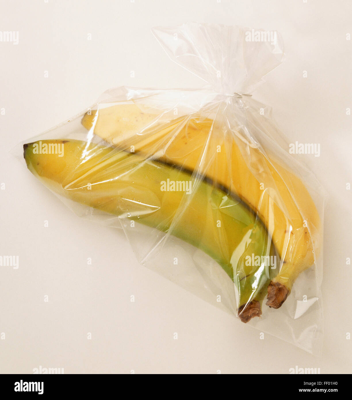 Two bananas sealed in a clear plastic bag Stock Photo Alamy