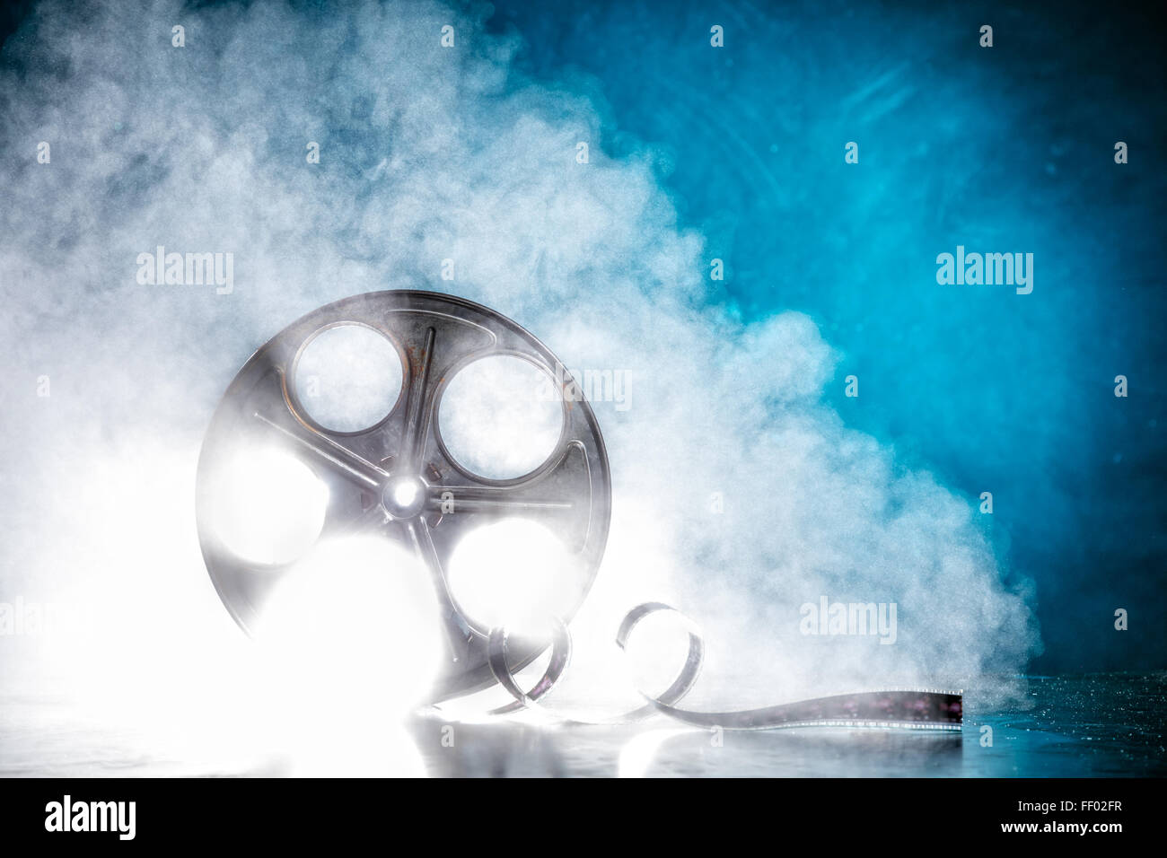 Reel of film with smoke and backlight Stock Photo