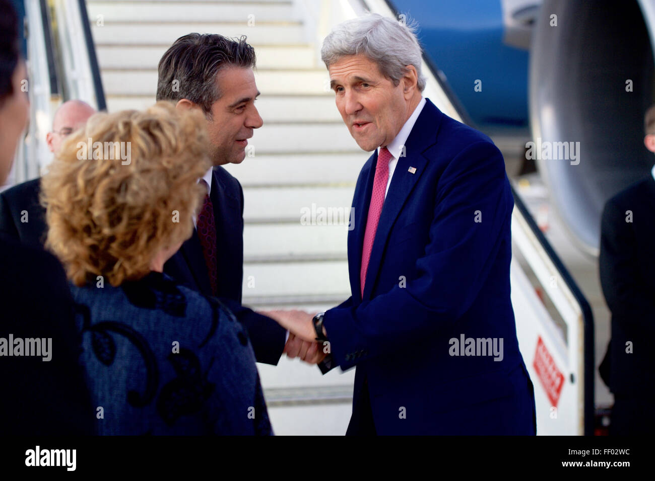 Secretary Kerry Shakes Hands With Cypriot Ministry of Foreign Affairs Chief of Protocol Kountourides Upon His Arrival in Cyprus Stock Photo