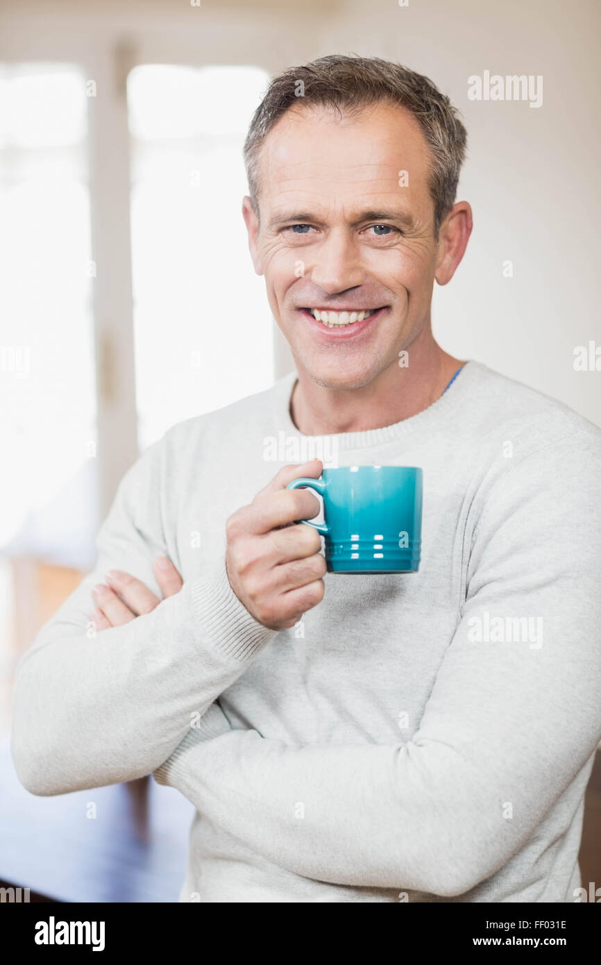 Handsome man having a cup of coffee Stock Photo