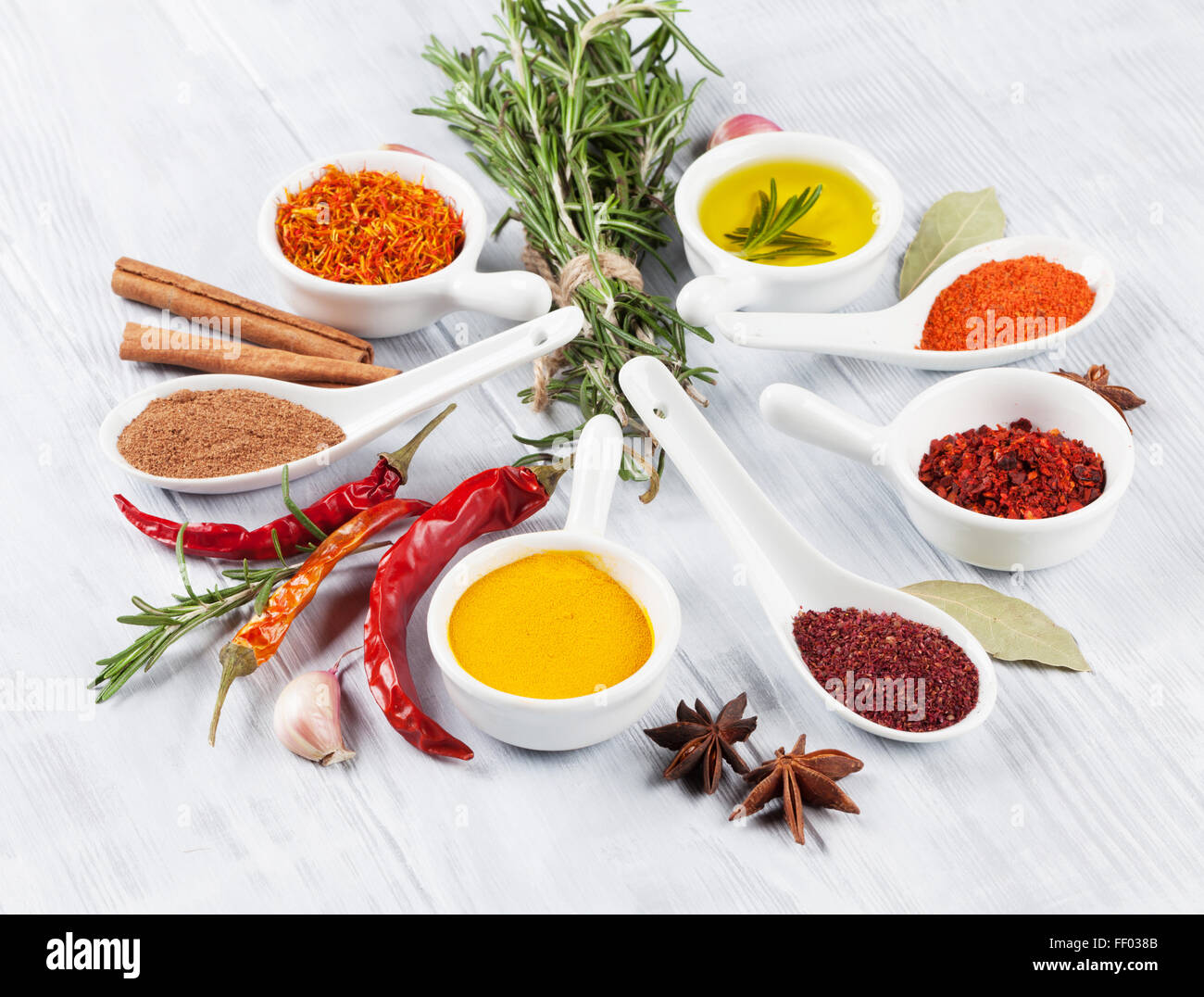 Herbs, condiments and spices on wooden background Stock Photo