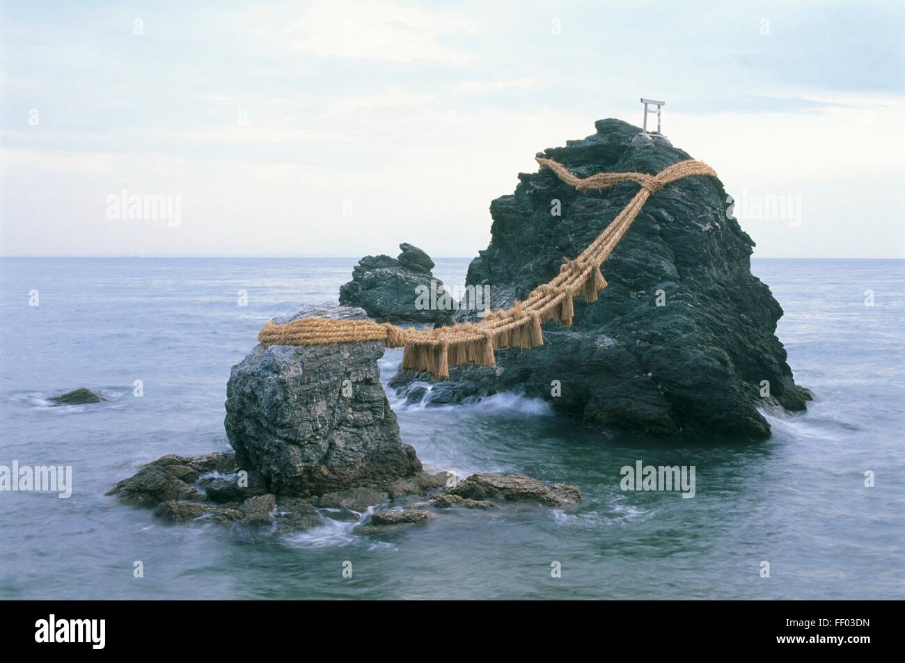 Japan, Honshu, Mie, Futami, the two rocks of Meoto Iwa (wedded rocks) connected by a rope, representing the union of the gods Izanami and Izanagi Stock Photo