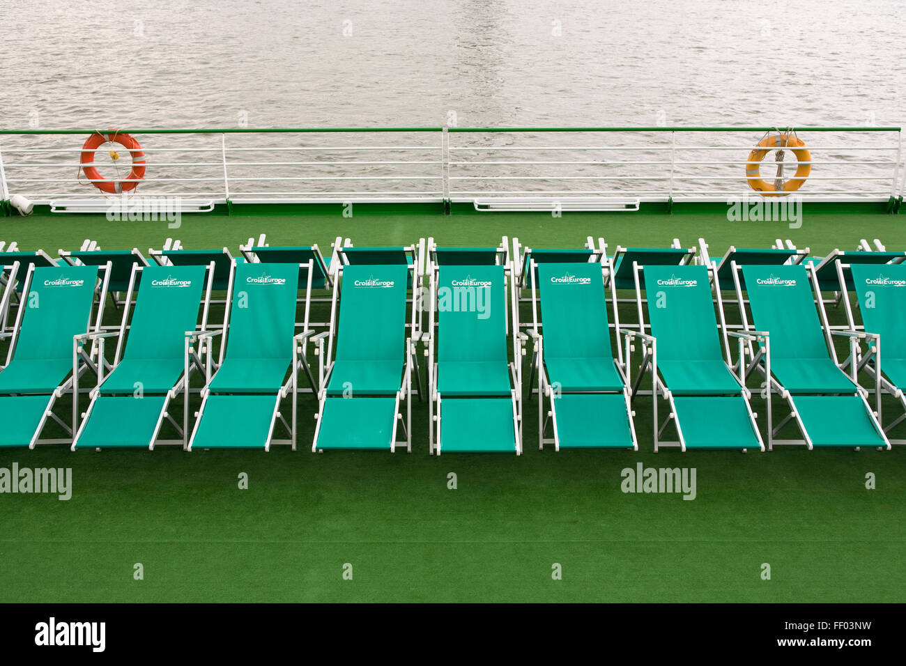Europe, Germany, Cologne, sunloungers on the deck of a ship at the banks of the river Rhine.  Europa, Deutschland, Koeln, Sonnen Stock Photo