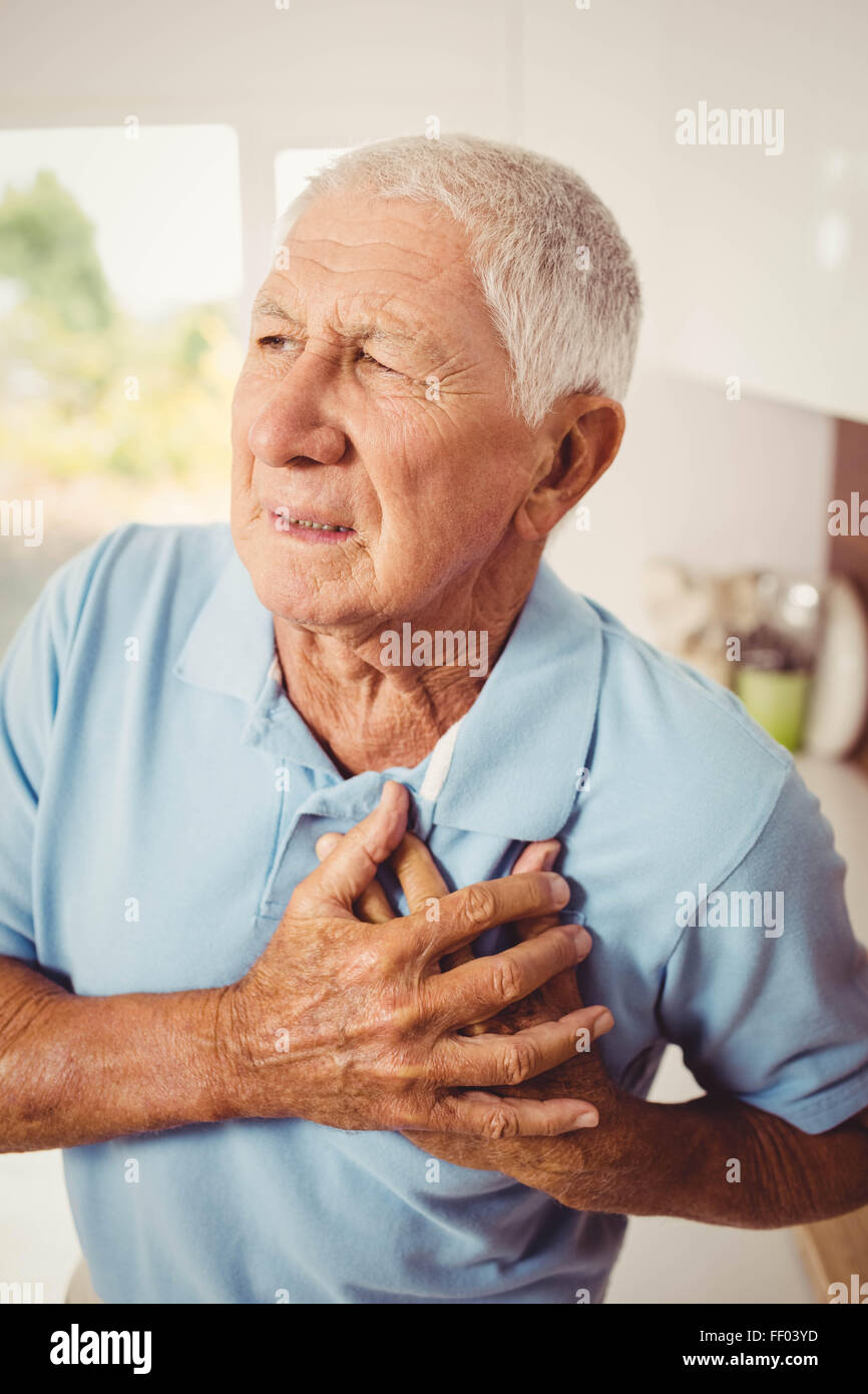 Painful senior man with pain on hea Stock Photo