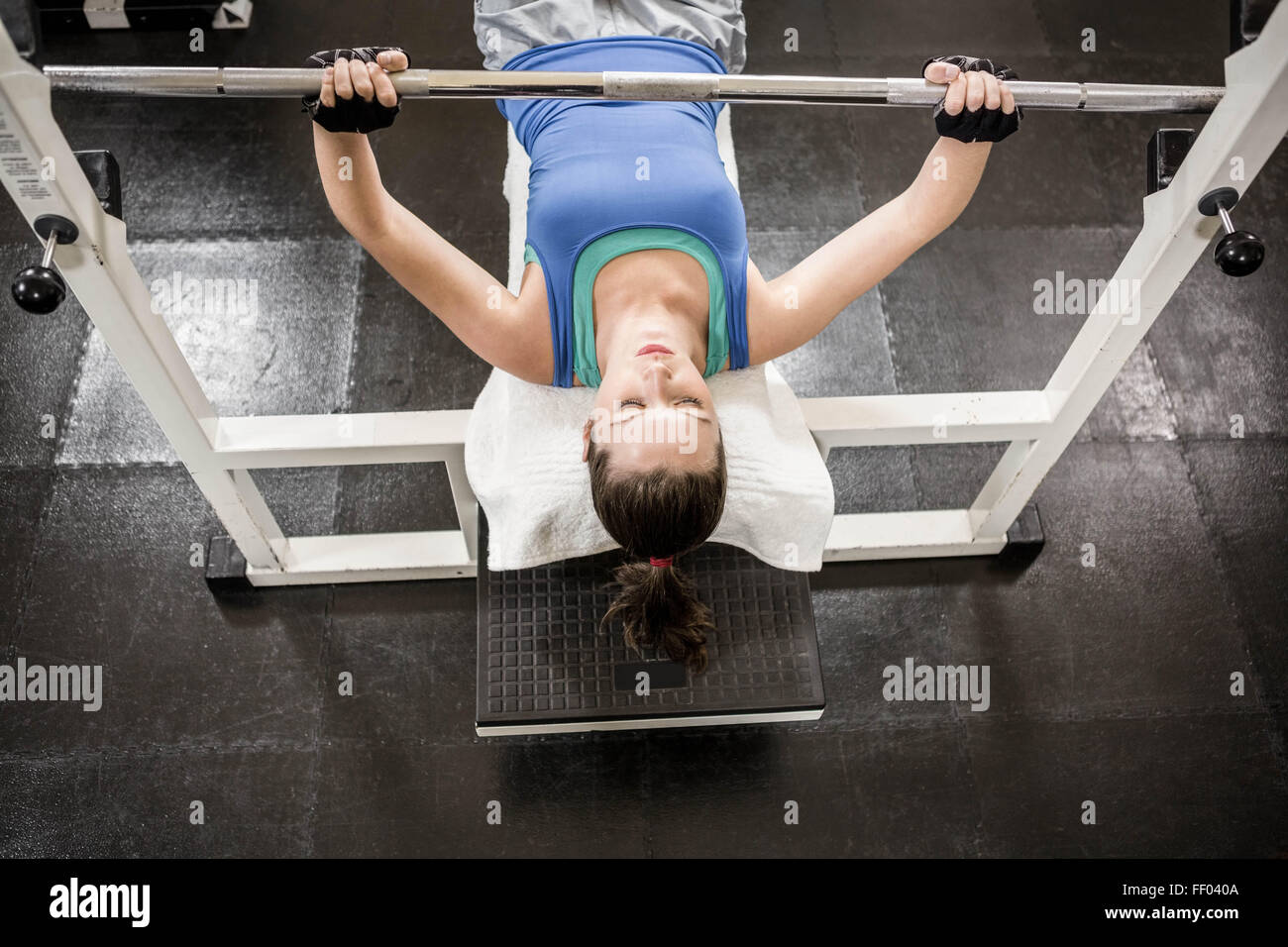 Fit woman lifting the barbell on bench Stock Photo - Alamy