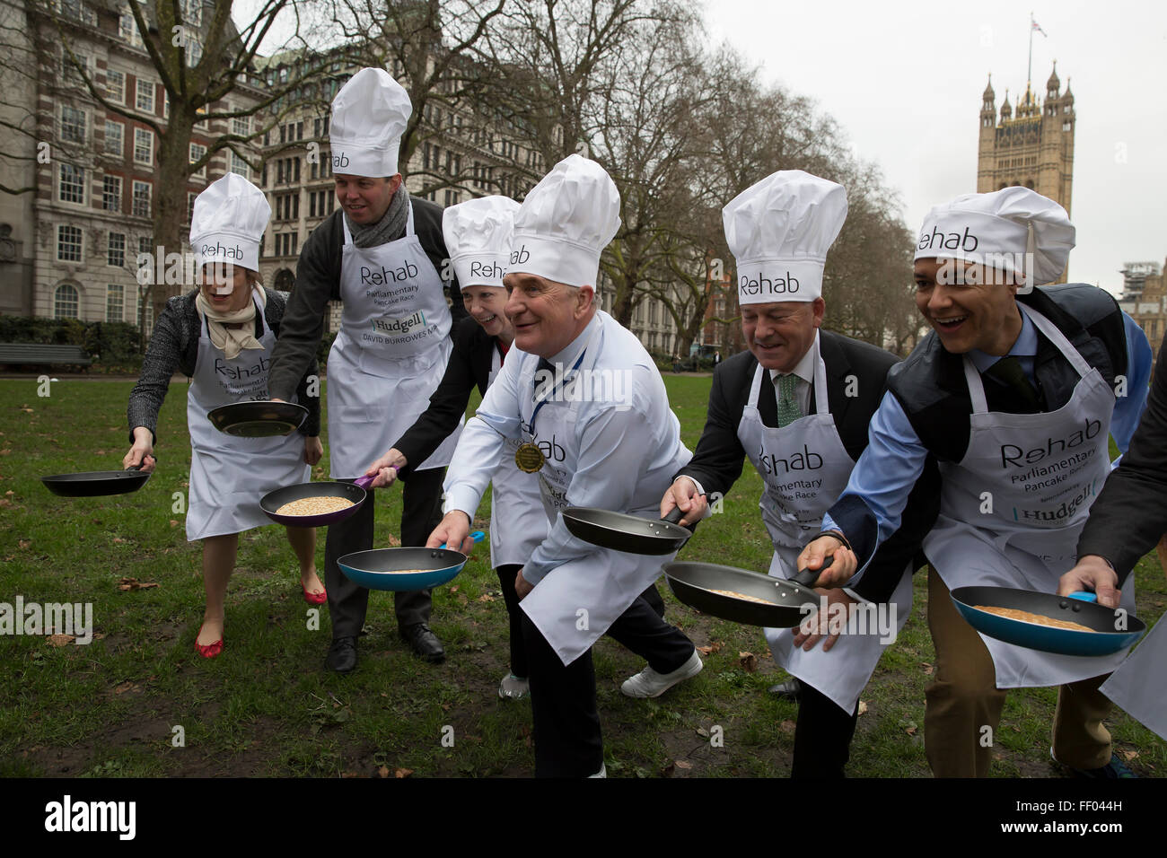 Westminster,UK, 9th February 2016, MP's win the Rehab annual pancake race and pose for photos while tossing pancake Credit: Keith Larby/Alamy Live News Stock Photo