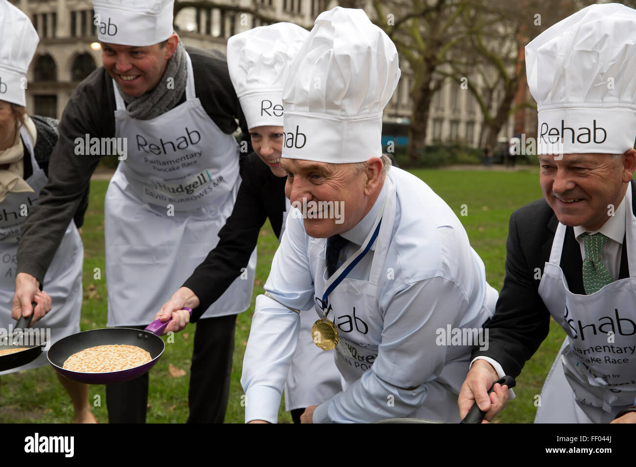 Westminster,UK, 9th February 2016, MP's win the Rehab annual pancake race and pose for photos while tossing pancakes Credit: Keith Larby/Alamy Live News Stock Photo