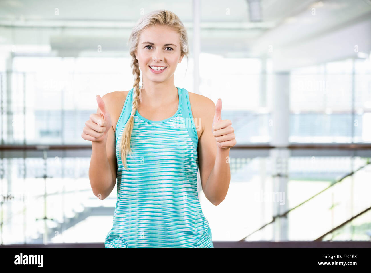 Blonde woman standing thumbs up hi-res stock photography and images - Alamy
