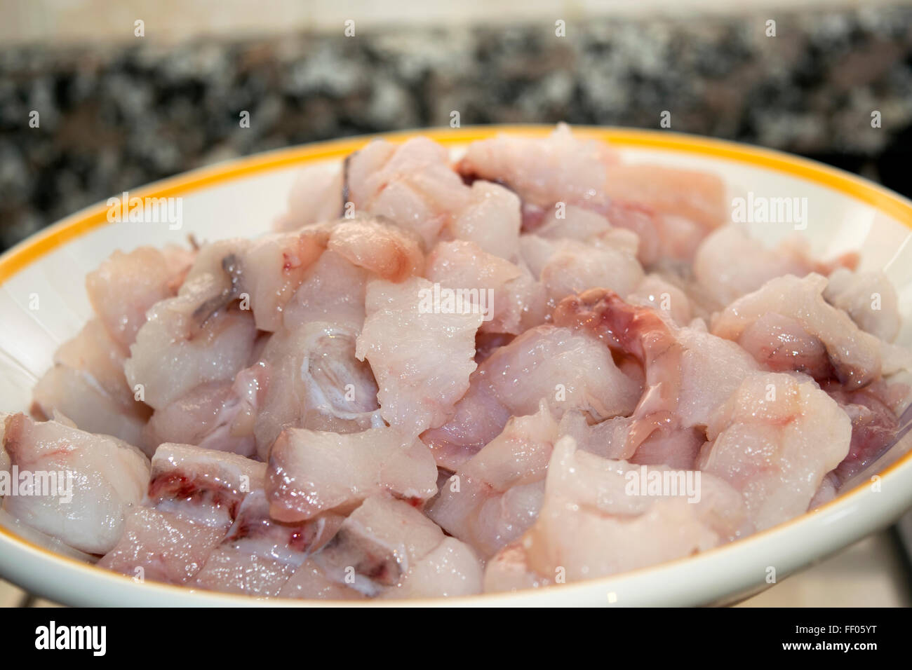 monkfish chopped in small pieces to prepare a sauce for pasta Stock Photo