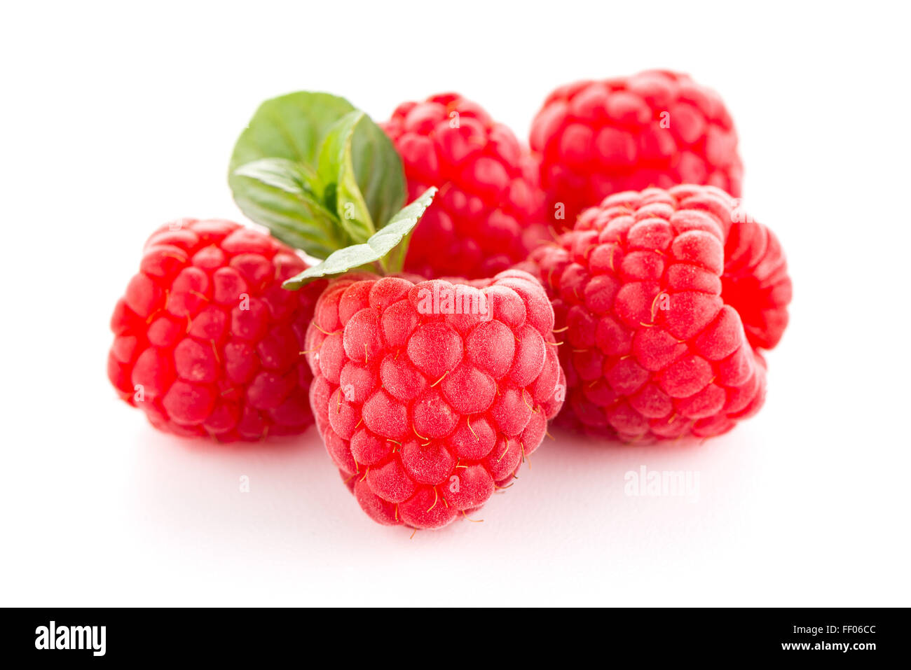 Raspberries with leaves isolated on white background Stock Photo - Alamy